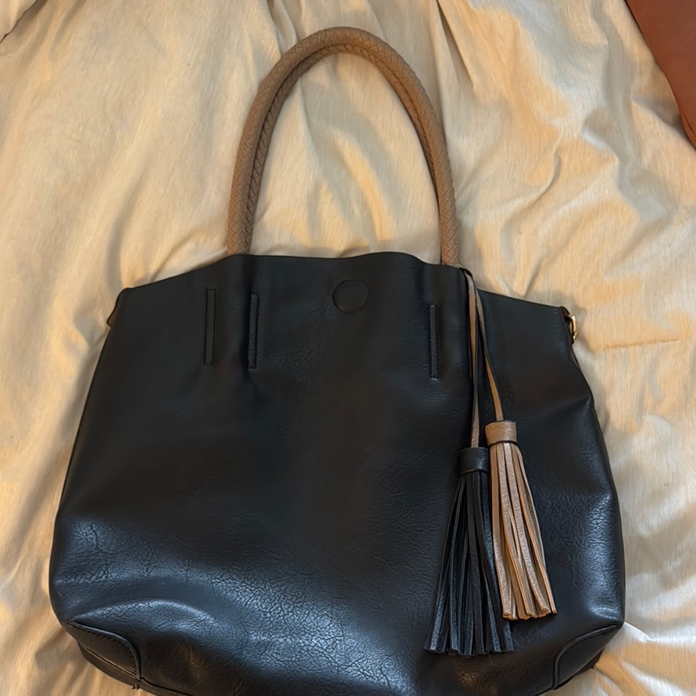 Chic Black and Tan Leather Tote with Tassel Accent